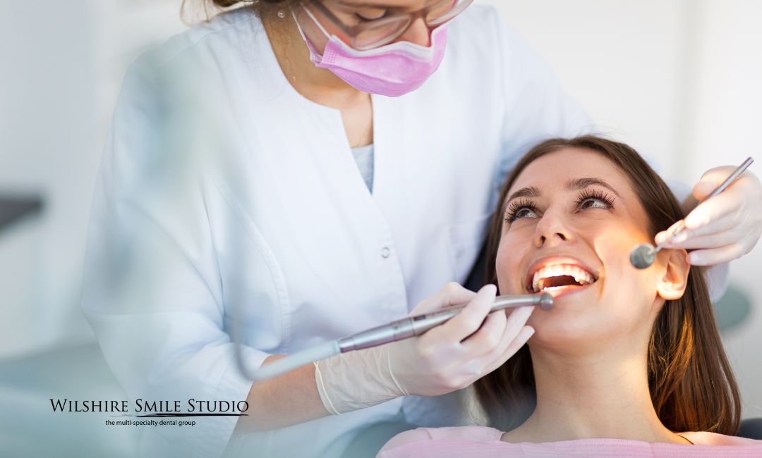 general dentist woman smiling in dental chair general dentist woman smiling in dental chair