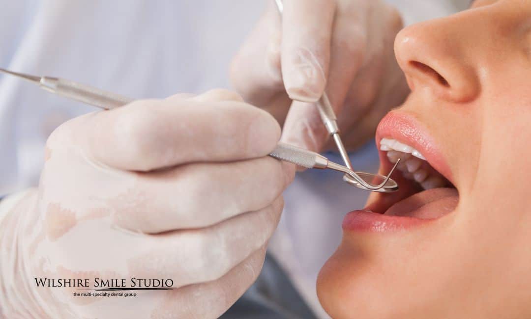 general dentistry woman with dental tool in mouth general dentistry woman with dental tool in mouth