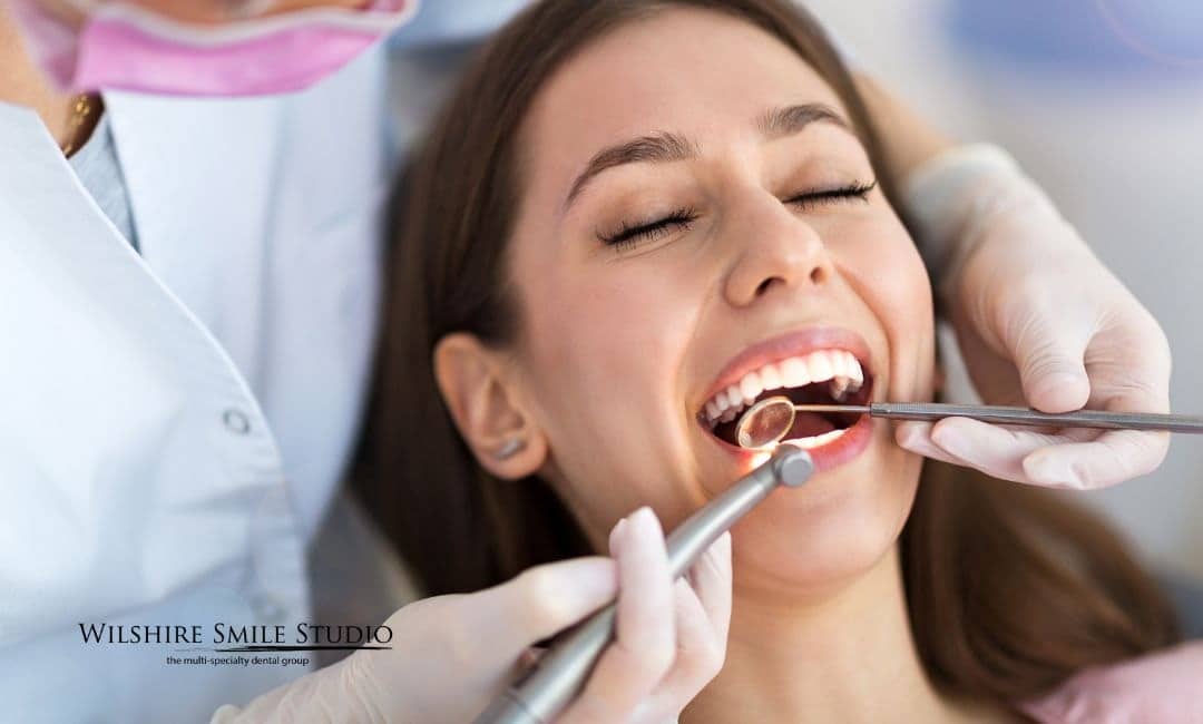 dentist checking patient in dental chair dentist checking patient in dental chair