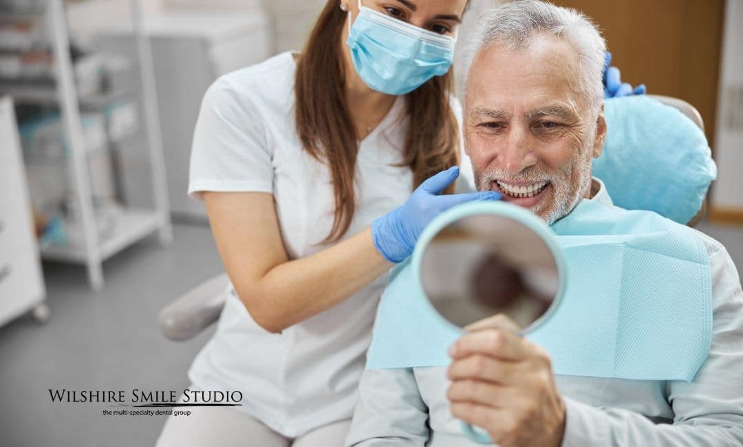 old man getting dental implants old man getting dental implants