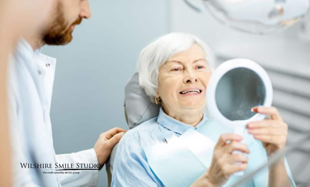 old woman getting dental implants old woman getting dental implants
