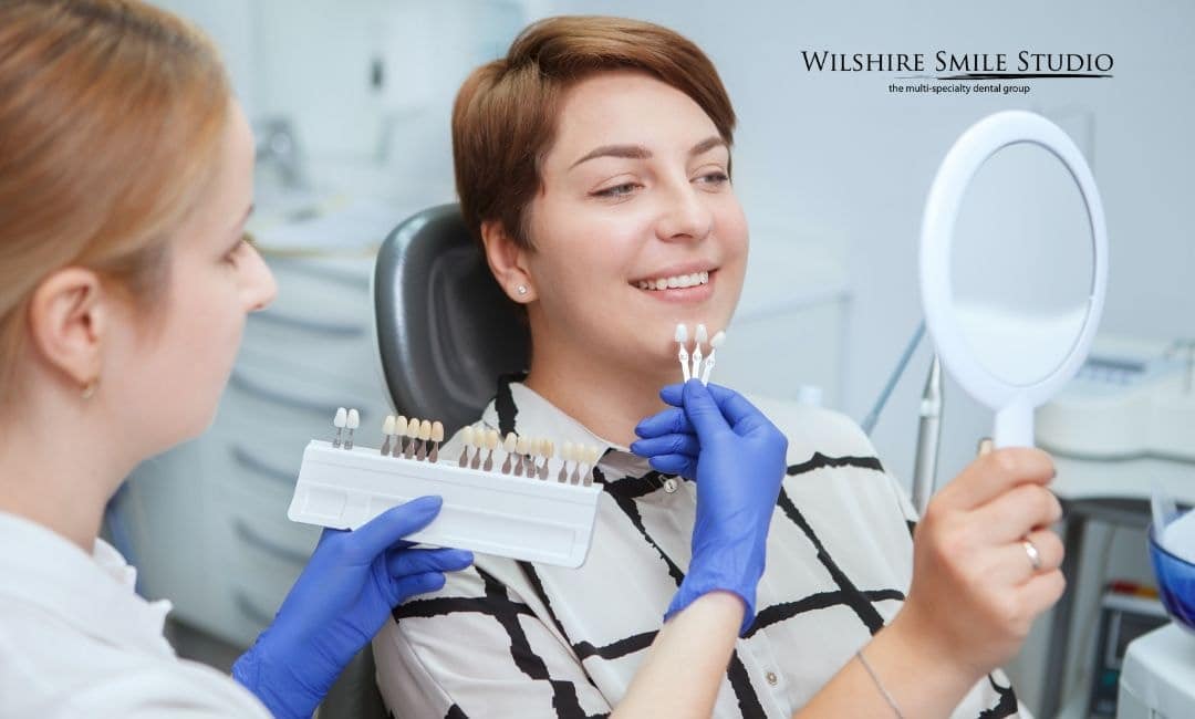 patient looking at teeth shades patient looking at teeth shades
