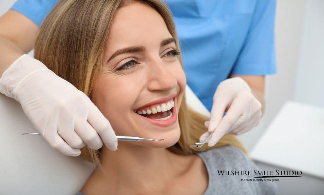 patient smiling at dentist office patient smiling at dentist office