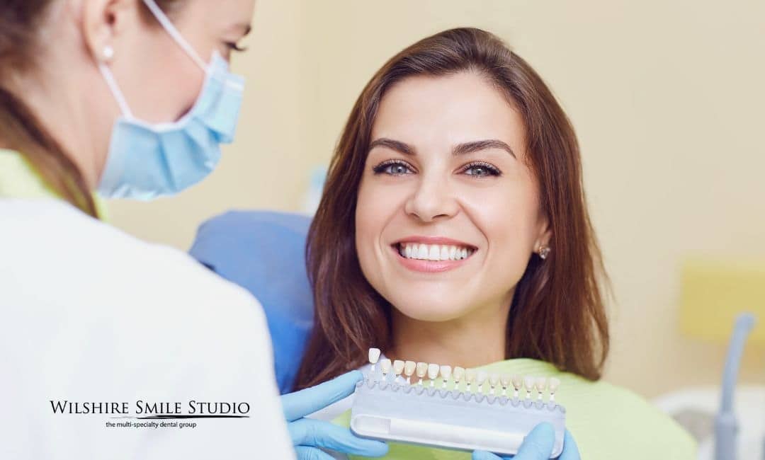 young woman checking teeth colors young woman checking teeth colors
